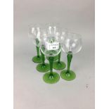 A SET OF TWELVE HOCK GLASSES WITH GREEN STEMS