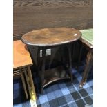 A MAHOGANY OVAL TWO TIER OCCASIONAL TABLE AND MAHOGANY NEST OF THREE TABLES