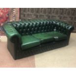 A GREEN LEATHER THREE SEAT SETTEE