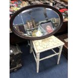 A MAHOGANY OVAL WALL MIRROR AND A BEDROOM CHAIR