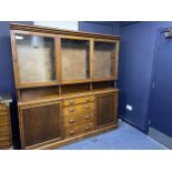 A STAINED WOOD PANTRY CUPBOARD