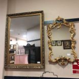 A GILT FRAMED WALL MIRROR AND ANOTHER