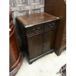 A REPRODUCTION MAHOGANY CUPBOARD