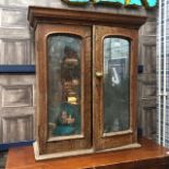 A VICTORIAN OAK TWO DOOR BOOKCASE