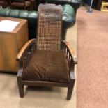 A PAIR OF EARLY 20TH CENTURY CANE PANELLED RECLINER ARMCHAIRS