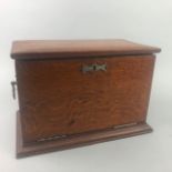 AN EARLY 20TH CENTURY OAK STATIONARY BOX