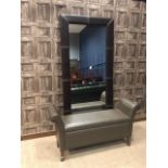 A FAUX LEATHER WALL MIRROR AND A MODERN OTTOMAN