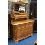 A VICTORIAN WALNUT DRESSING CHEST