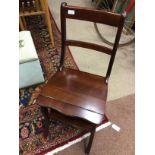 A MAHOGANY LIBRARY CHAIR