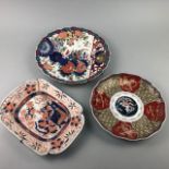 A JAPANESE IMARI CIRCULAR PLAQUE ALONG WITH TWO OTHERS