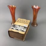 A PAIR OF CARNIVAL GLASS VASES AND A VINTAGE COOKBOOK