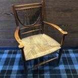 A 19TH CENTURY RAIL BACKED CHAIR