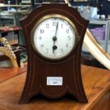 AN EDWARDIAN MAHOGANY CASED MANTEL CLOCK