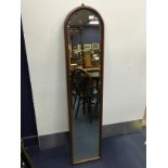 A MAHOGANY WALL HANGING MIRROR