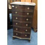 A REPRODUCTION MAHOGANY SERPENTINE FRONTED CHEST OF SIX DRAWERS