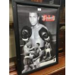 A FRAMED PRINT OF MOHAMMED ALI