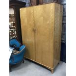 AN ELDERS SATINWOOD TWO DOOR WARDROBE