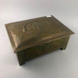 AN EARLY 20TH CENTURY EMBOSSED BRASS SLIPPER BOX