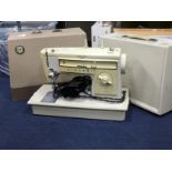 A LOT OF TWO SINGER PORTABLE SEWING MACHINES