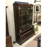 A STAINED WOOD BOOKCASE