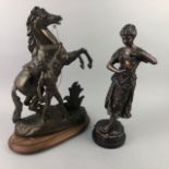 A BRONZED FIGURE GROUP OF A MAN ON HORSEBACK AND OTHER VARIOUS FIGURES
