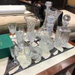 A LOT OF THREE CRYSTAL DECANTERS, VASES AND GLASSES