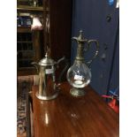 A GLASS AND SILVER PLATED CLARET JUG AND A WATER JUG