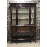 AN EDWARDIAN MAHOGANY BREAKFRONT DISPLAY CABINET