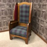 AN OAK FRAMED PORTER'S CHAIR OF ARTS & CRAFTS DESIGN