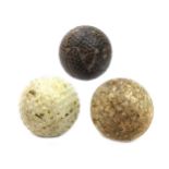 AN LATE 19TH/EARLY 20TH CENTURY HASKELL TYPE GOLF BALL ALONG WITH TWO OTHERS