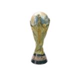 A LLADRO PORCELAIN MODEL OF THE FIFA WORLD CUP TROPHY