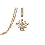 AMENDMENT: THE CHAIN IS MARKED 15, THE CLASP IS MARKED 9K A PERIDOT AND SEED PEARL PENDANT
