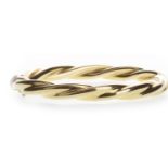 A GOLD TWIST BANGLE