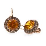 A PAIR OF YELLOW GEM SET AND DIAMOND EARRINGS