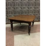 A VICTORIAN WALNUT DINING TABLE