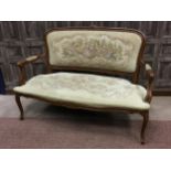 A 20TH CENTURY CARVED WOOD SETTEE OF FRENCH DESIGN