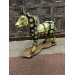 AN EARLY 20TH CENTURY PAINTED PAPIER MACHE NURSERY HORSE