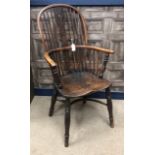 AN EARLY 19TH CENTURY YEW, OAK AND ELM HIGH BACK WINDSOR ELBOW CHAIR