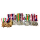 A LOT OF SEVENTEEN 1939-1945 MEDALS, TWO DEFENCE MEDALS AND FOUR STARS
