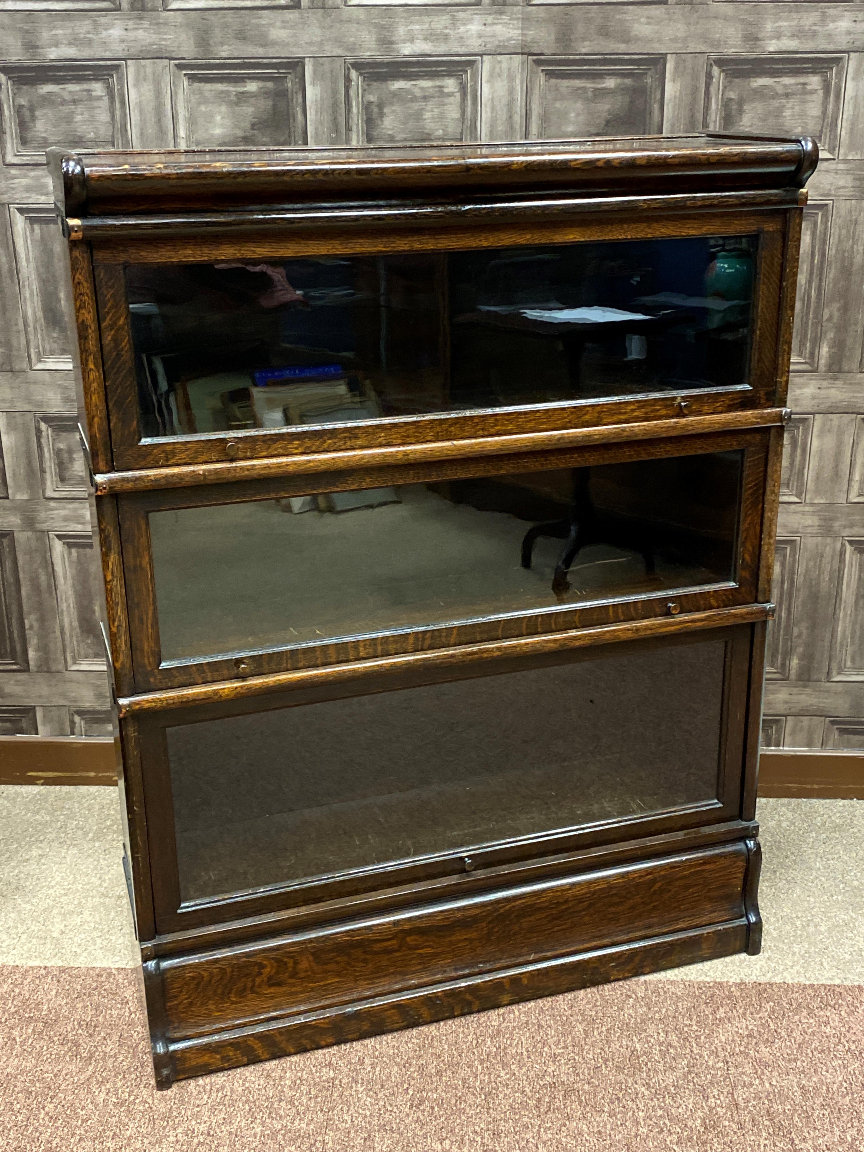 AN OAK SECTIONAL BOOKCASE