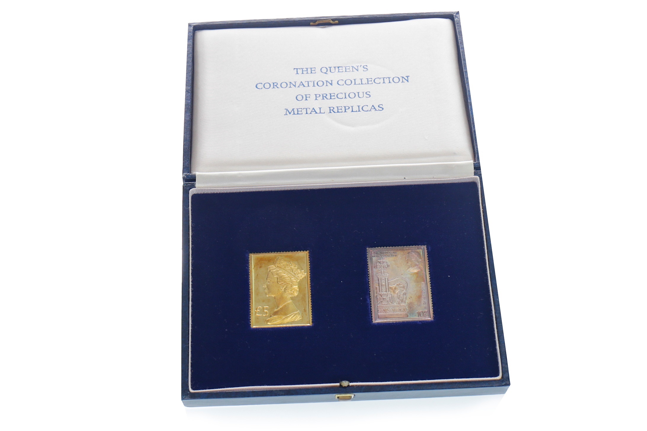A GOLD AND SILVER STAMP SET