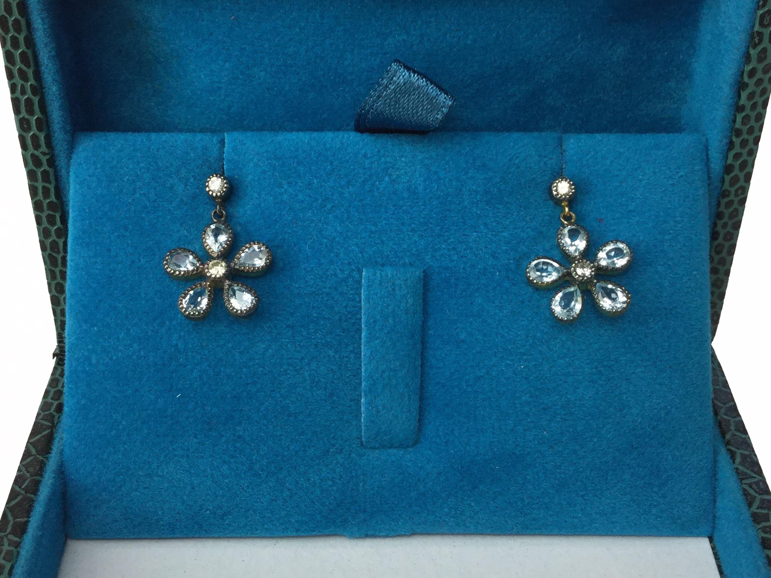 A PAIR OF TOPAZ FLOWER EARRINGS