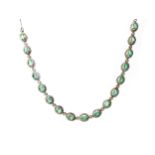 A GREEN GEM AND DIAMOND NECKLACE AND EARRINGS