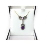 AN AMETHYST AND DIAMOND PENDANT