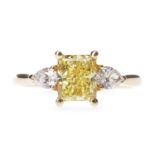 A GIA CERTIFICATED FANCY VIVID YELLOW DIAMOND RING