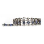 AN IMPRESSIVE BLUE GEM AND DIAMOND BRACELET AND EARRINGS