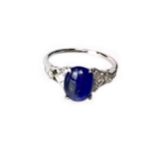 A SAPPHIRE AND DIAMOND RING