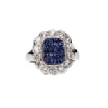 A SAPPHIRE AND DIAMOND RING