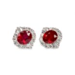 A PAIR OF TREATED RUBY AND DIAMOND EARRINGS