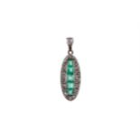 AN EMERALD AND DIAMOND PENDANT